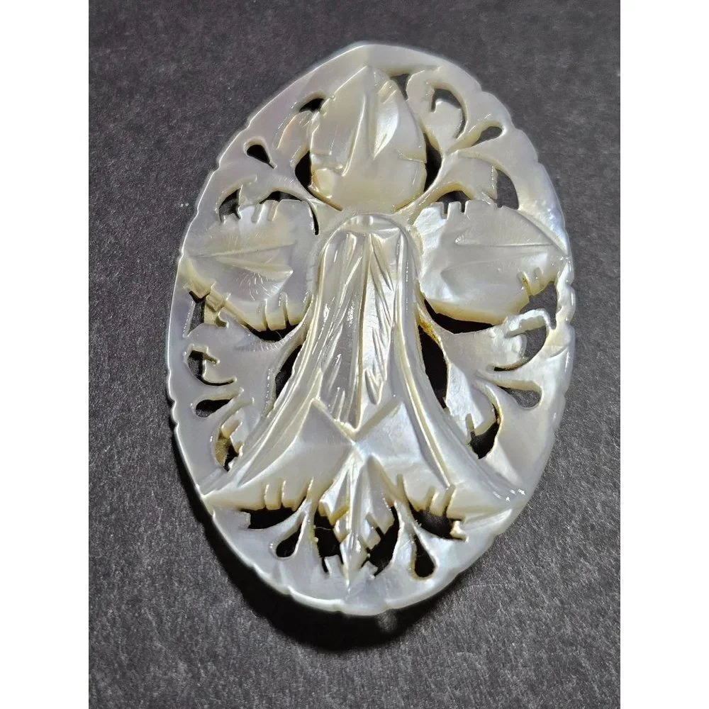 Vintage mother of pearl carved brooch